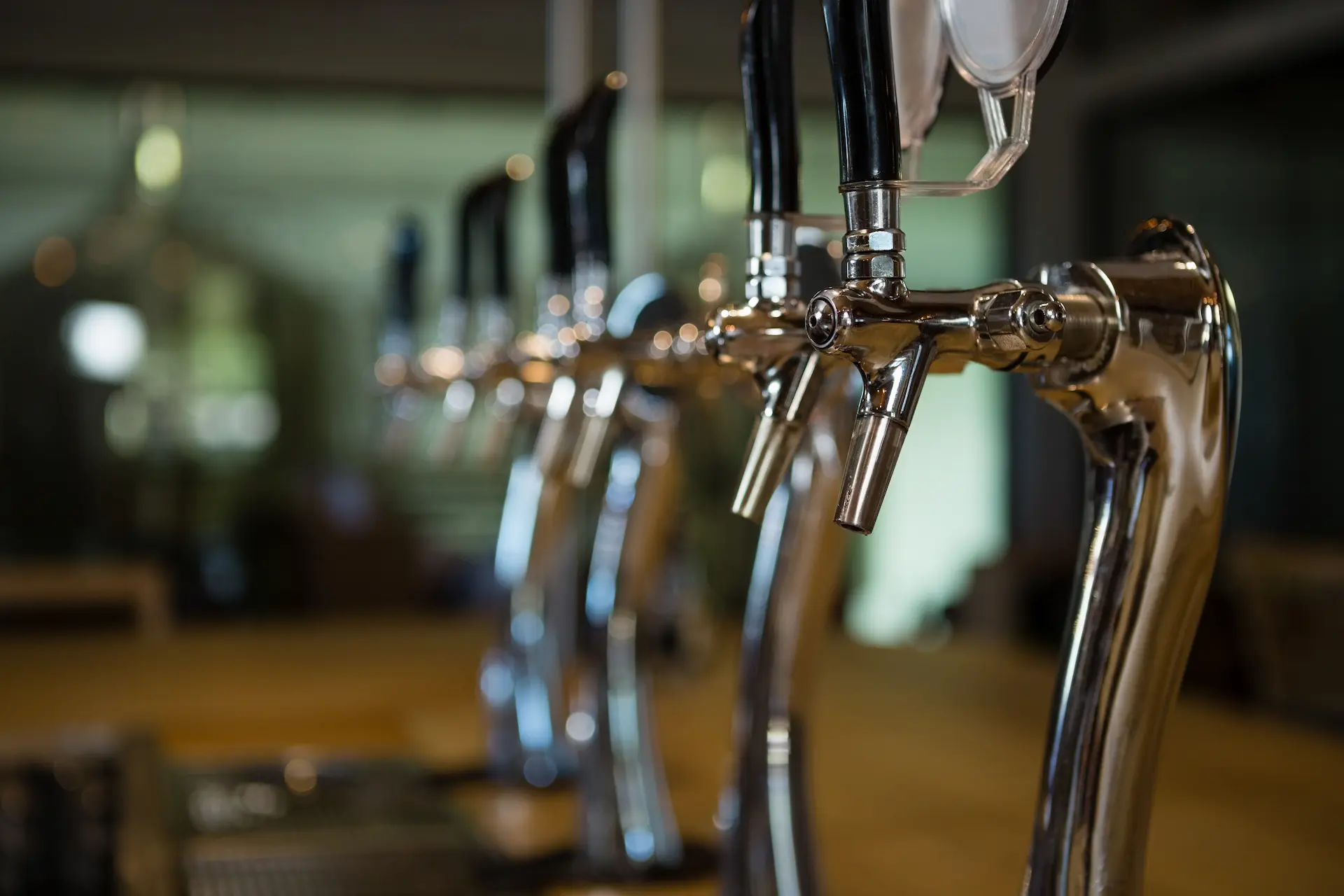 A row of taps at a local brewery
